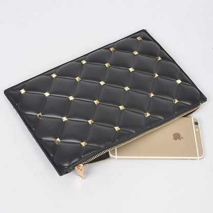 black quilted vegan pouch with gold studs and iphone to show scale against a white background