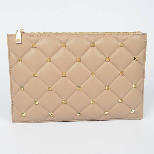 A nude-colored, quilted faux leather pouch with gold studs, closed with a magnetic snap against a white background