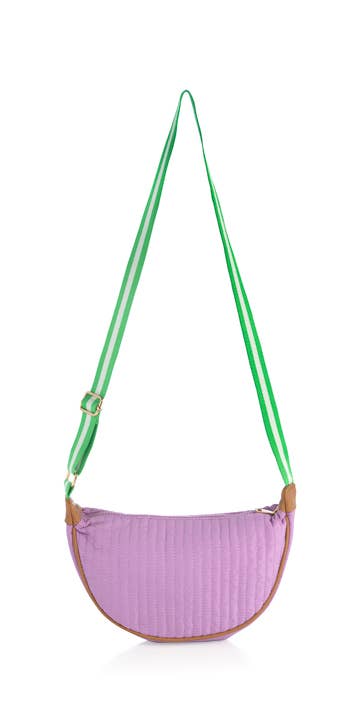 A quilted cross body bag with a striped green strap and a purple body, displayed against a white background.