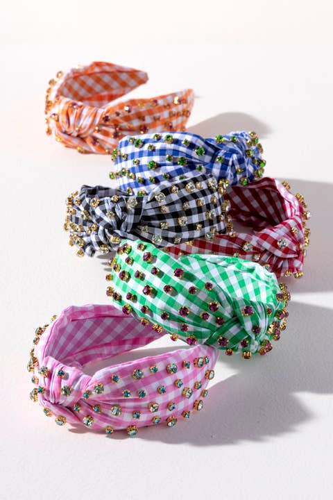 Set of colorful checkered headbands with decorative elements on a white background