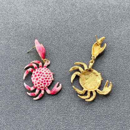 front and back view of pink and white enamal crab earrings