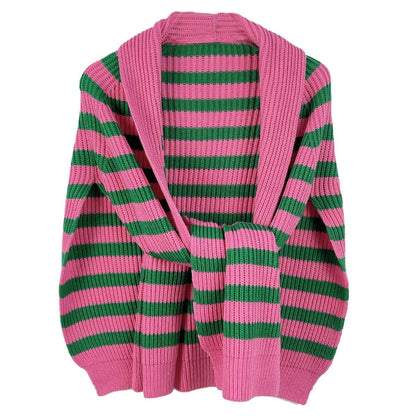 flat lay of pink and green stripe sweater scarf on a white background