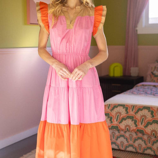 woman wearing pink and orange short sleeve dress