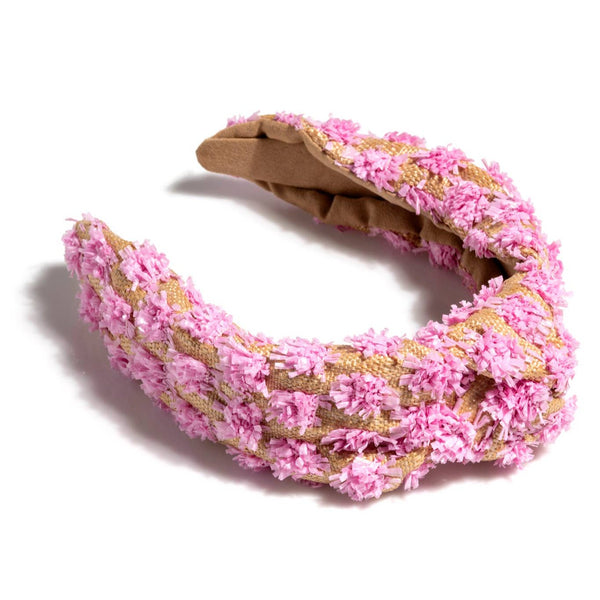 Pink raffia knotted headband with chunky twisted design — casual loungewear styling