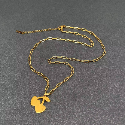 the back view of a cherry pendant necklace with gold chain