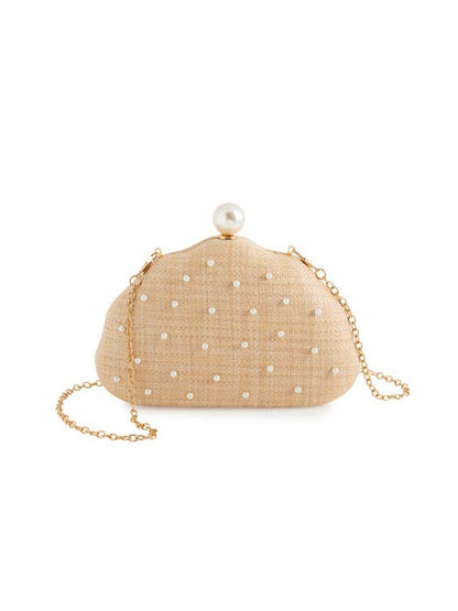 Pearl and raffia clutch purse with scattered pearl embellishments — front flat lay view showing round seashell shape and natural raffia texture