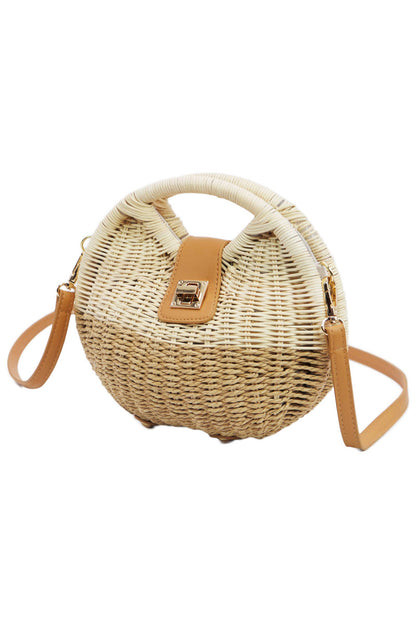 side view of tan woven cross body bag with gold hardware and shoulder strap