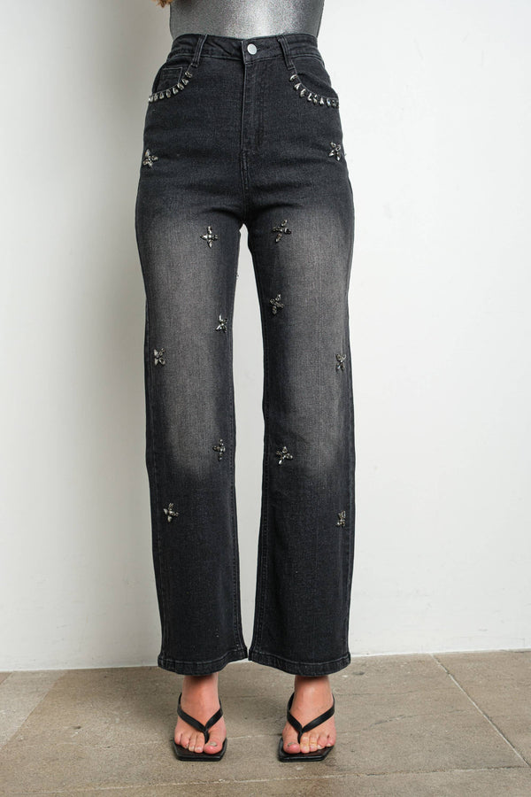 Black straight leg jeans with scattered gunmetal rhinestone embellishments — front view styled with black sandals