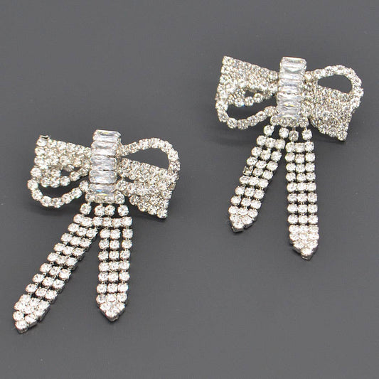 a pair of ribbon rhinestone earrings 