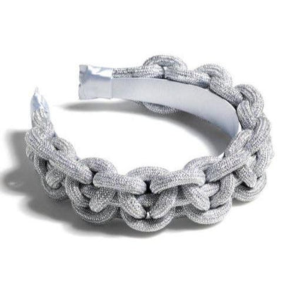 silver braided headband against a white background