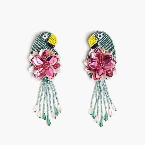 a pair of tucan and floral beaded dandle earrings