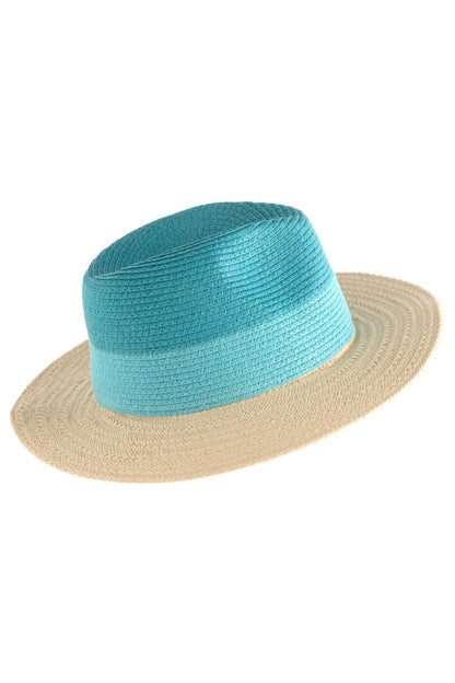 A turquoise and beige color block patterned hat made from natural straw, with an adjustable band against a white background