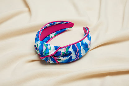 Watercolor print knotted headband in blue pink and green on an ivory background