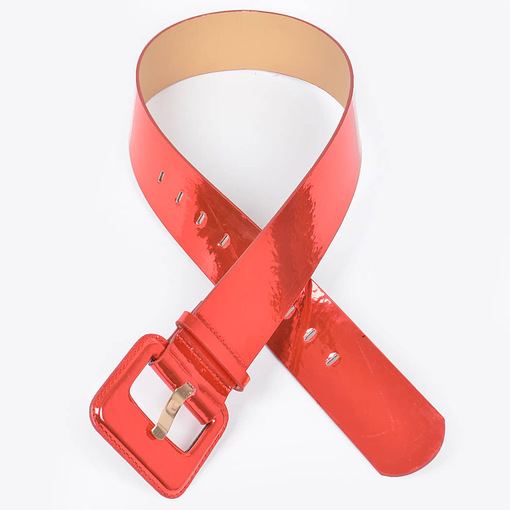 A red wide mirror belt on a flat lay against a white background