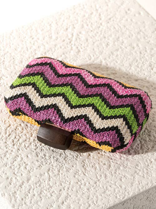 Colorful zigzag patterned object on a textured white surface